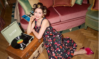 Sophie Ellis Bextor wears a floral nightie while listening to music. 