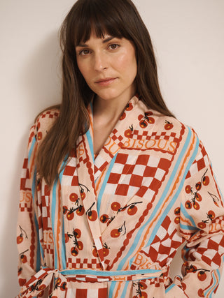 model wears a grandpa robe dressing gown with tomato print. close up. 