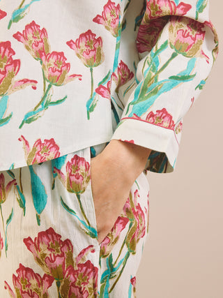 Close up of a pyjama set with Tulip print. Pocket detail. 