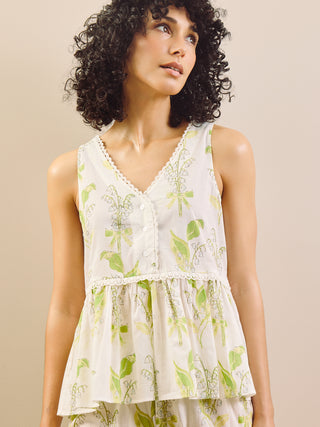 Model wears peplum top, floral print pyjama set