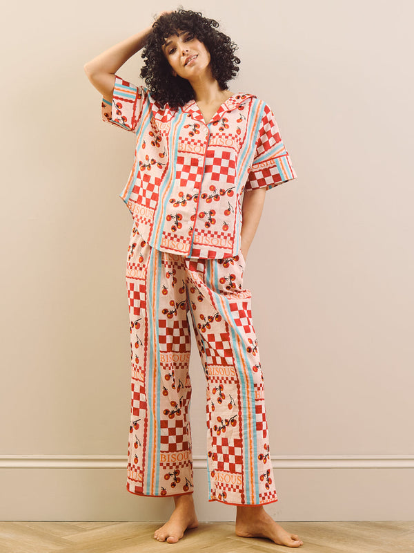 model wears red print long pyjama set with tomato design