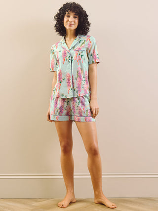 model wears wisteria print short pyjama set. 
