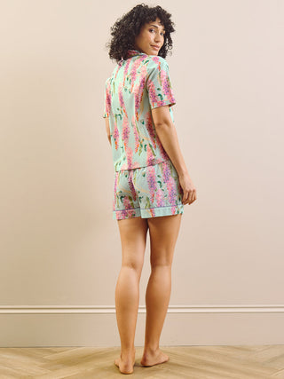 model wears wisteria print short pyjama set. Back detail