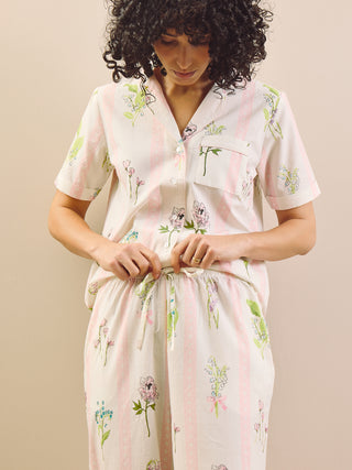 model wears scallop floral print pyjamas with tie waist