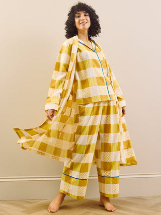 model wears a grandpa robe in large gingham check