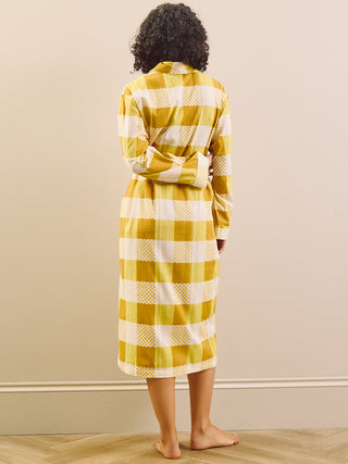 model wears a grandpa robe in large gingham check