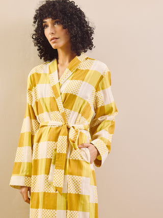 model wears a grandpa robe in large gingham check