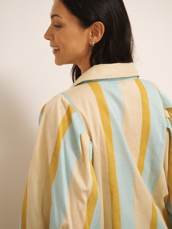 Model wearing a striped pyjama set against a plain background. Back detail