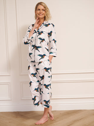 model wears humming bird print pyjamas