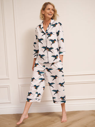model wears humming bird print pyjamas