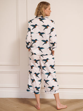 model wears humming bird print pyjamas. back detail. 