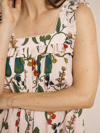 detail shot of floral pair print fabric with square nick and frill on a nightdress