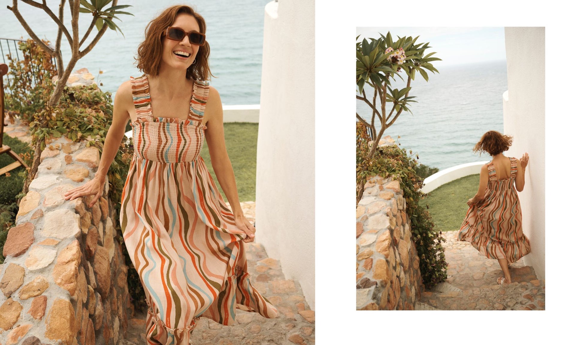 Woman in a striped dress standing on a stone path with ocean view