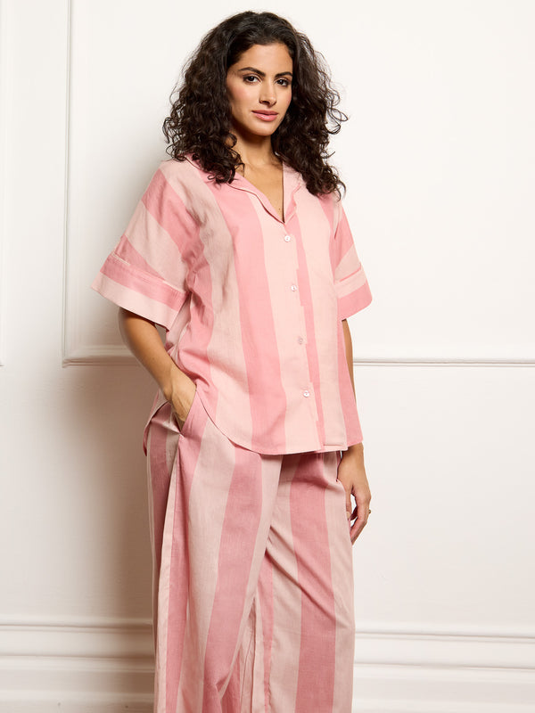 Model wears cotton pink stripe Their Nibs pyjamas, focus on top