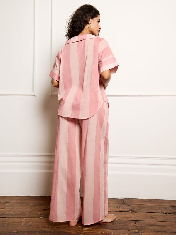 Model wears cotton pink stripe Their Nibs pyjamas, focus on back