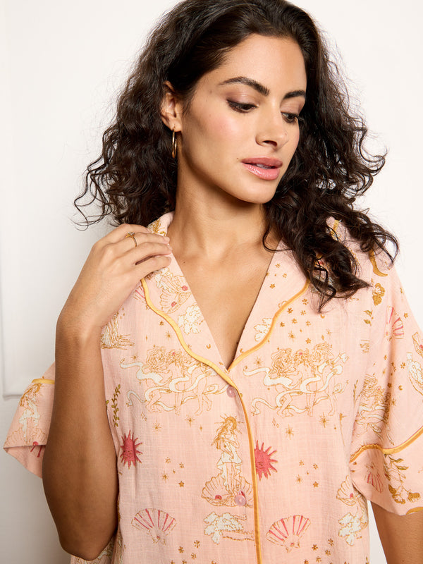 Model wears goddess love hand drawn print pyjamas - close up on button up top