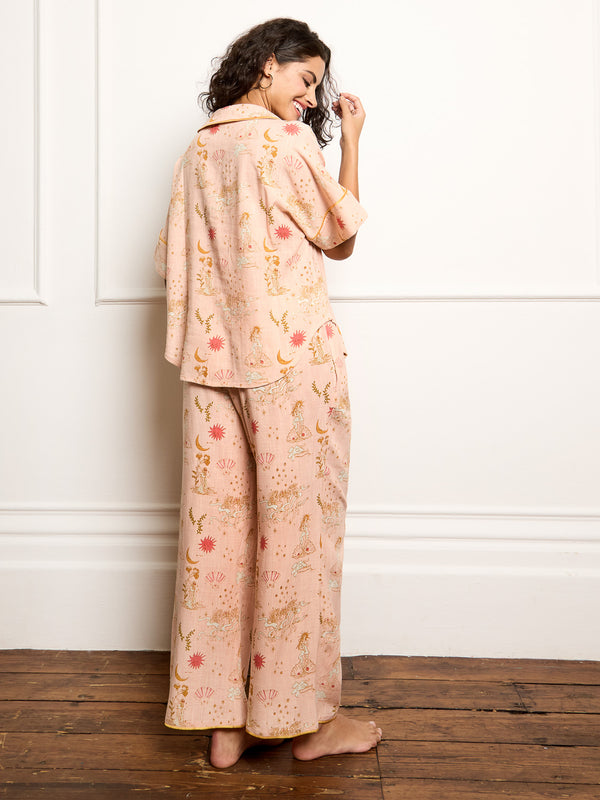 Model wears goddess love hand drawn print pyjamas - focus on back