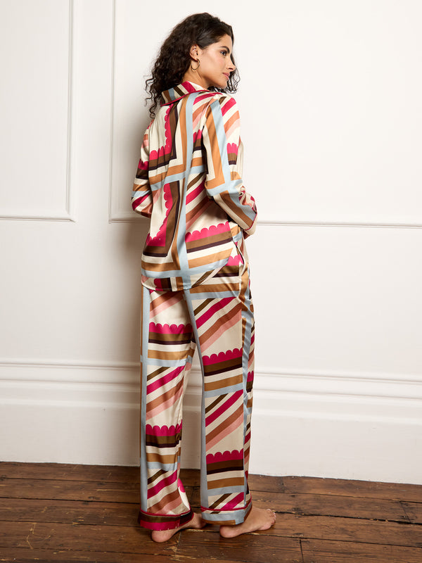 Model wears handkerchief print pyjamas in satin - focus on the back