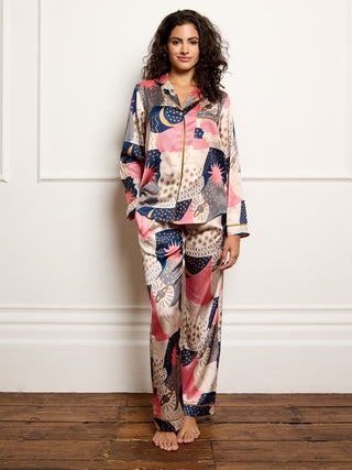 Model wears recycle satin pyjamas with moon and star print