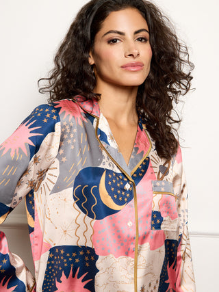 Model wears recycle satin pyjamas with moon and star print - close up