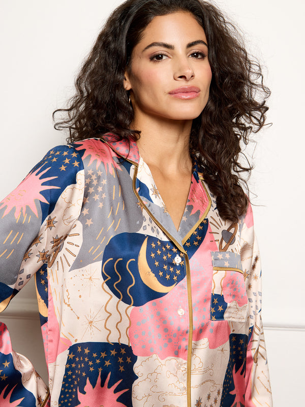 Model wears recycle satin pyjamas with moon and star print - close up