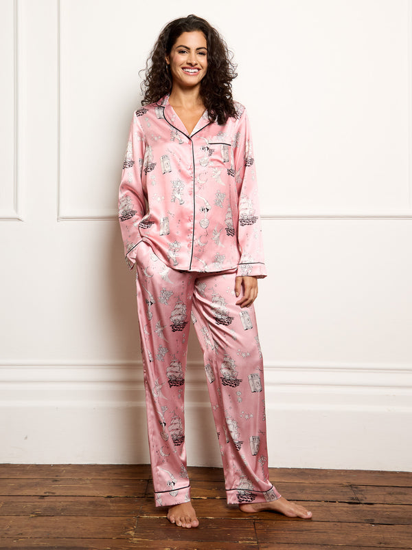 Model wears sailor tattoo inspired print in Their Nibs Long recycled satin pyjamas.