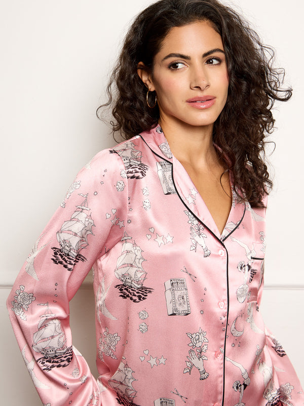 Model wears sailor tattoo inspired print in Their Nibs Long recycled satin pyjamas. Detail shot