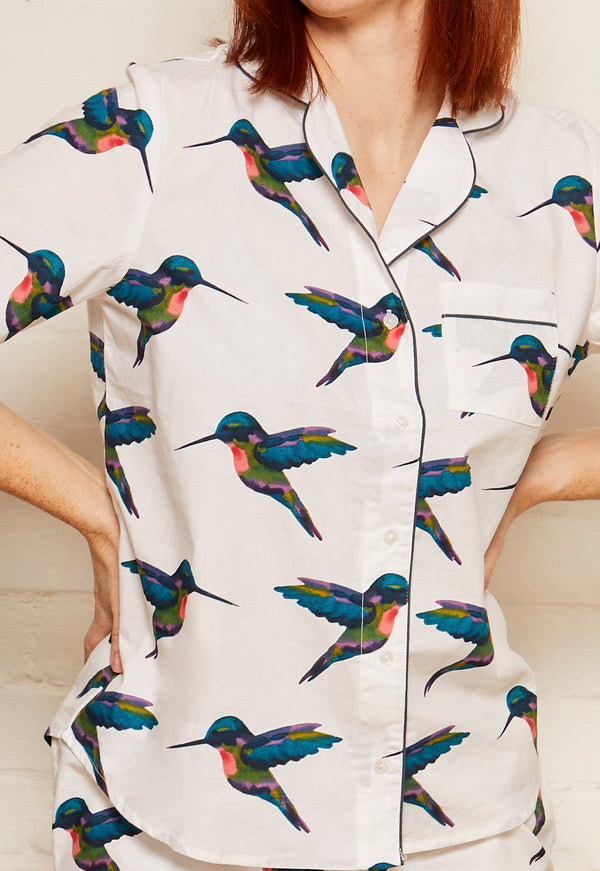 close up of hummingbird print on white cotton