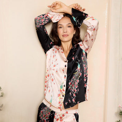 Woman wearing a floral and black pyjamas