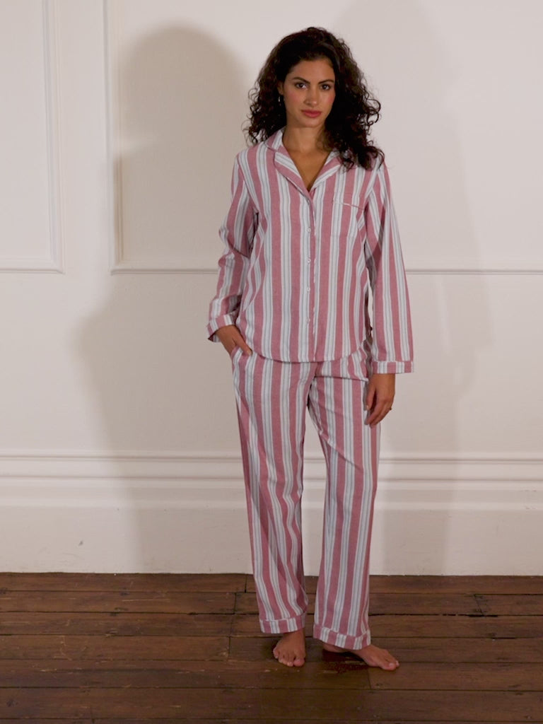 Models wears burgundy and blue stripe pyjamas