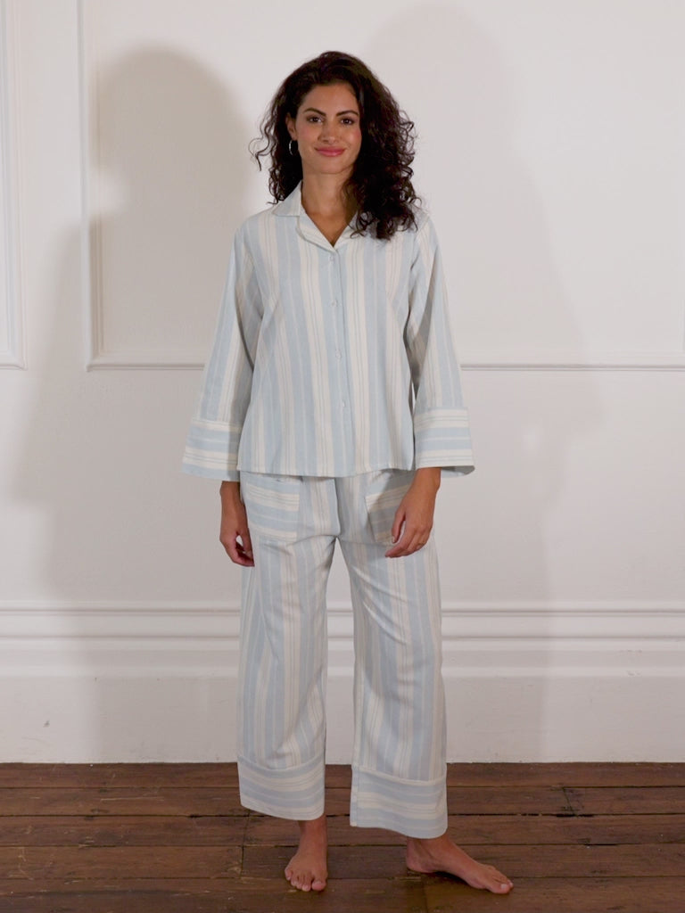 Model wears baby blue stripe pyjamas from Their Nibs
