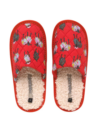 Red slippers with a patterned sole and fluffy interior on a white background