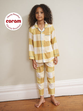 Child model wears yellow gingham long pyjama set