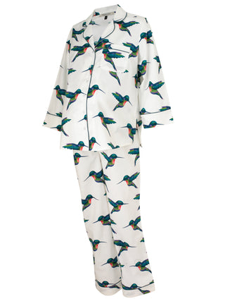 Angled shot to show bump example of Ladies cotton, shirt and trousers pjs, white base with hand painted hummingbird pattern, navy piping