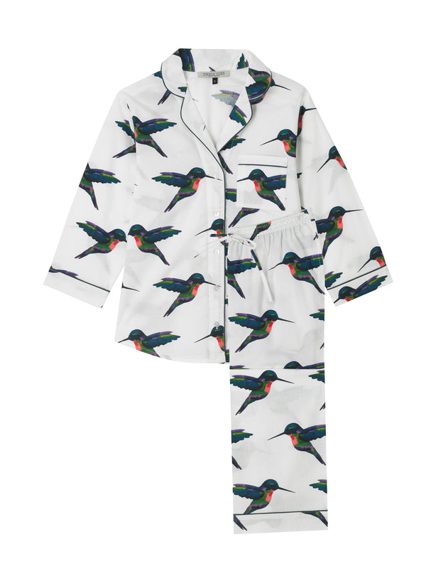 Flat shot of womens cotton, shirt and capri trouser Pjs, white base with multicoloured hummingbird pattern