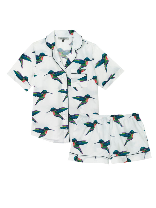 Flat shot of womens cotton, shirt and shorts pjs, white base with multicoloured hummingbird print, birds in flight in varying angles